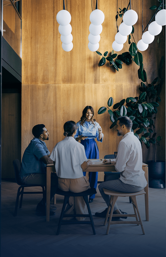 Woman presenting to colleagues